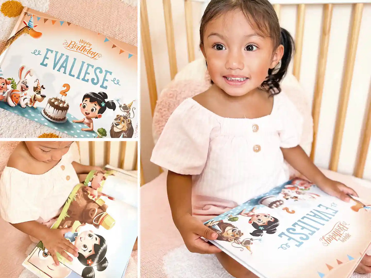 Bella bambina festeggia il suo secondo compleanno con un divertente libro fai-da-te con il suo nome.